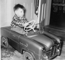 Photo of Wayne with his North Star toy car