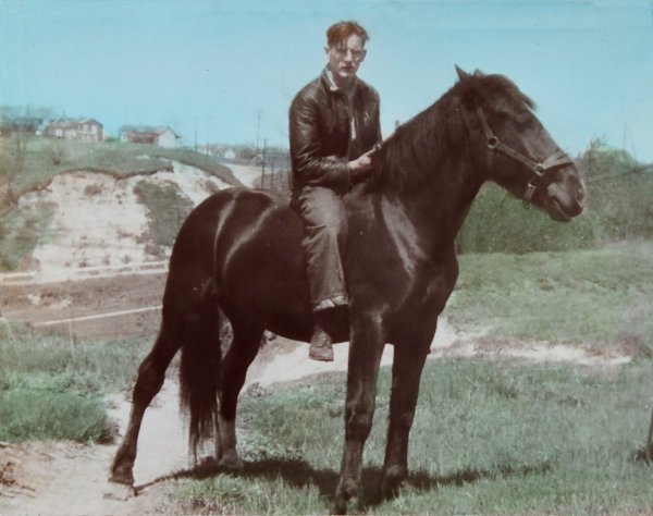 Photo of Ron on a black horse at the end of Blakley Avenue c. 1944 Photo of Ron on a black horse at the end of Blakley Avenue c. 1944